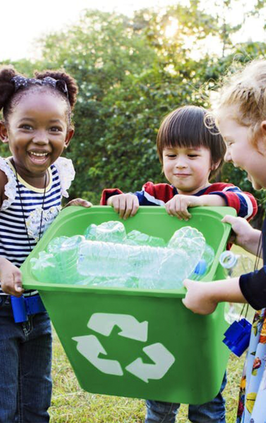 Kids recycling plastic bottles