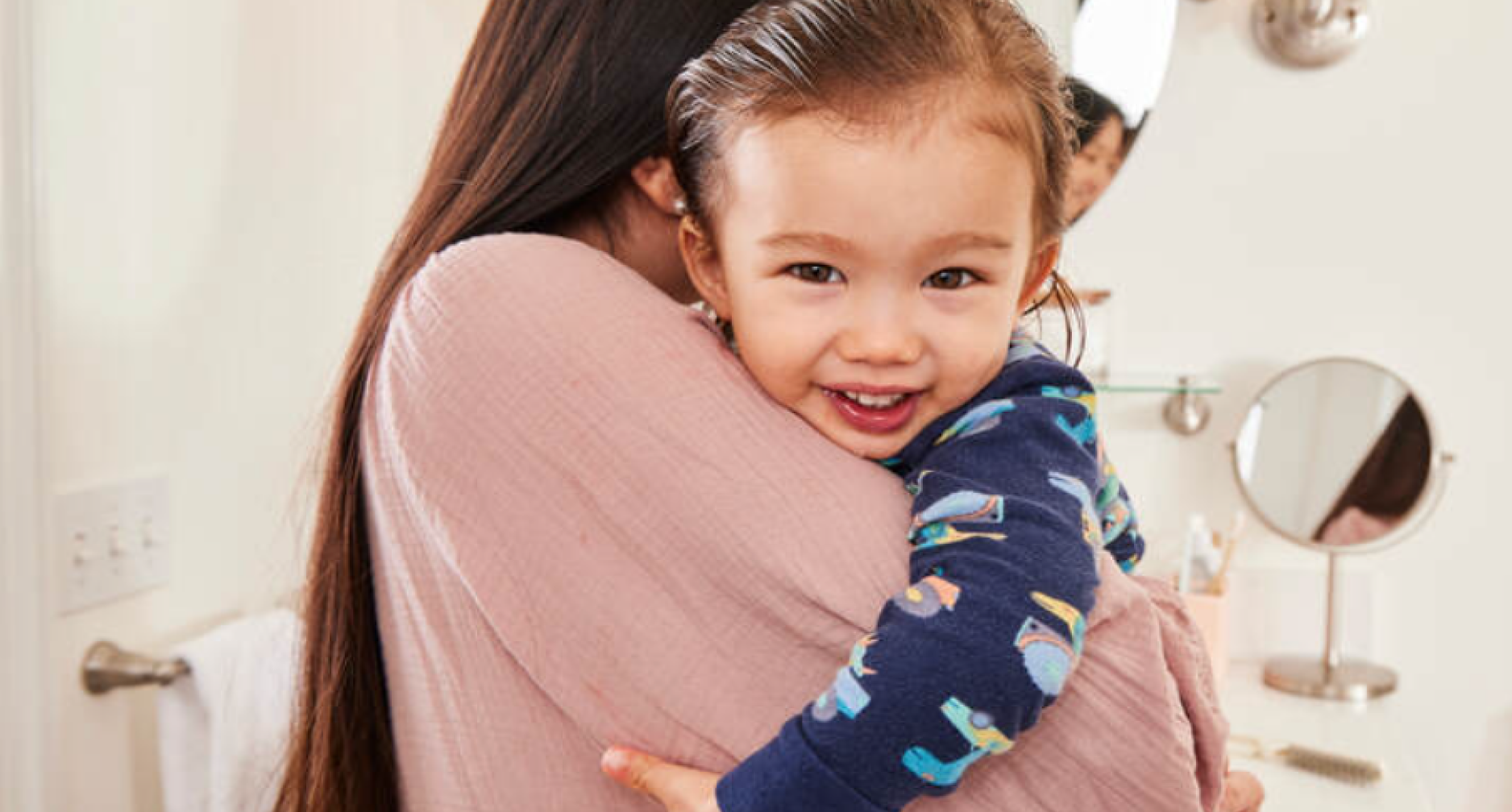 Mom and smiling daughter