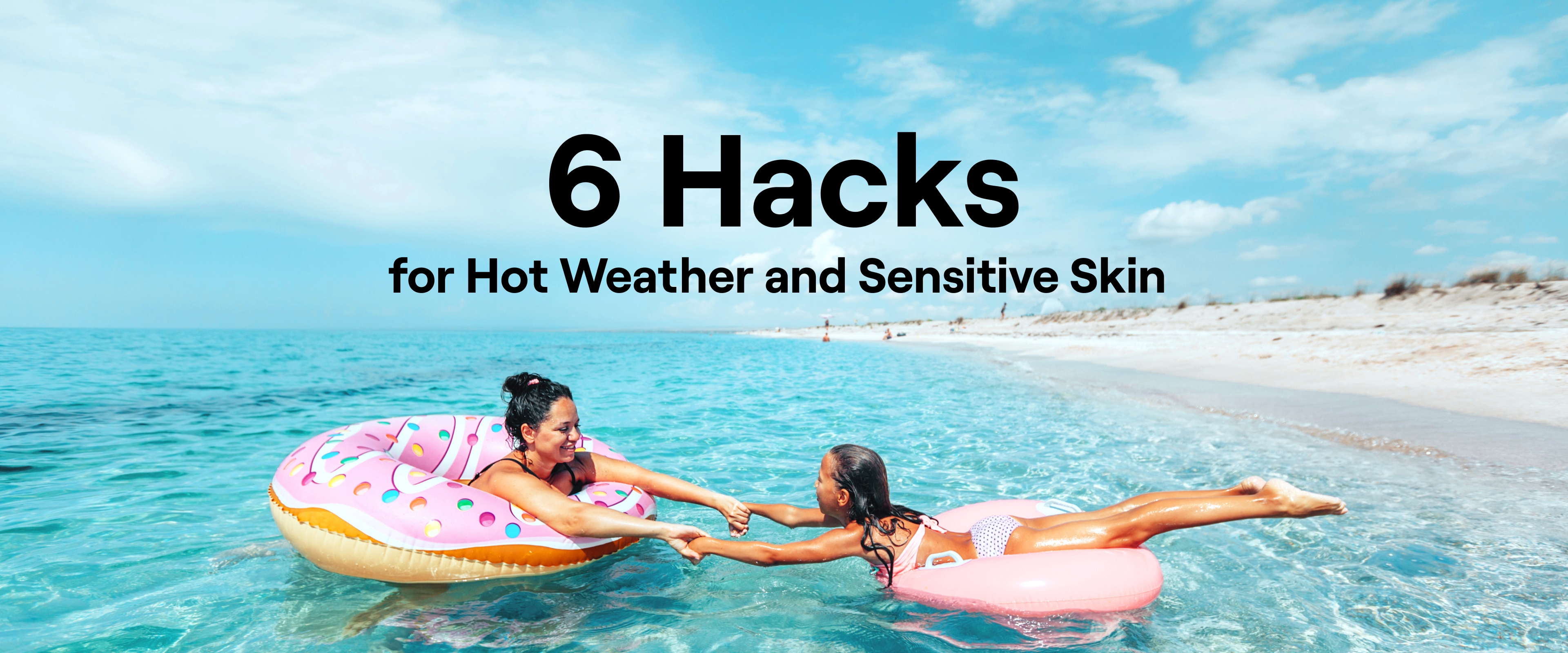 6 Hacks for Hot Weather and Sensitive Skin - adult and child playing in water along shoreline