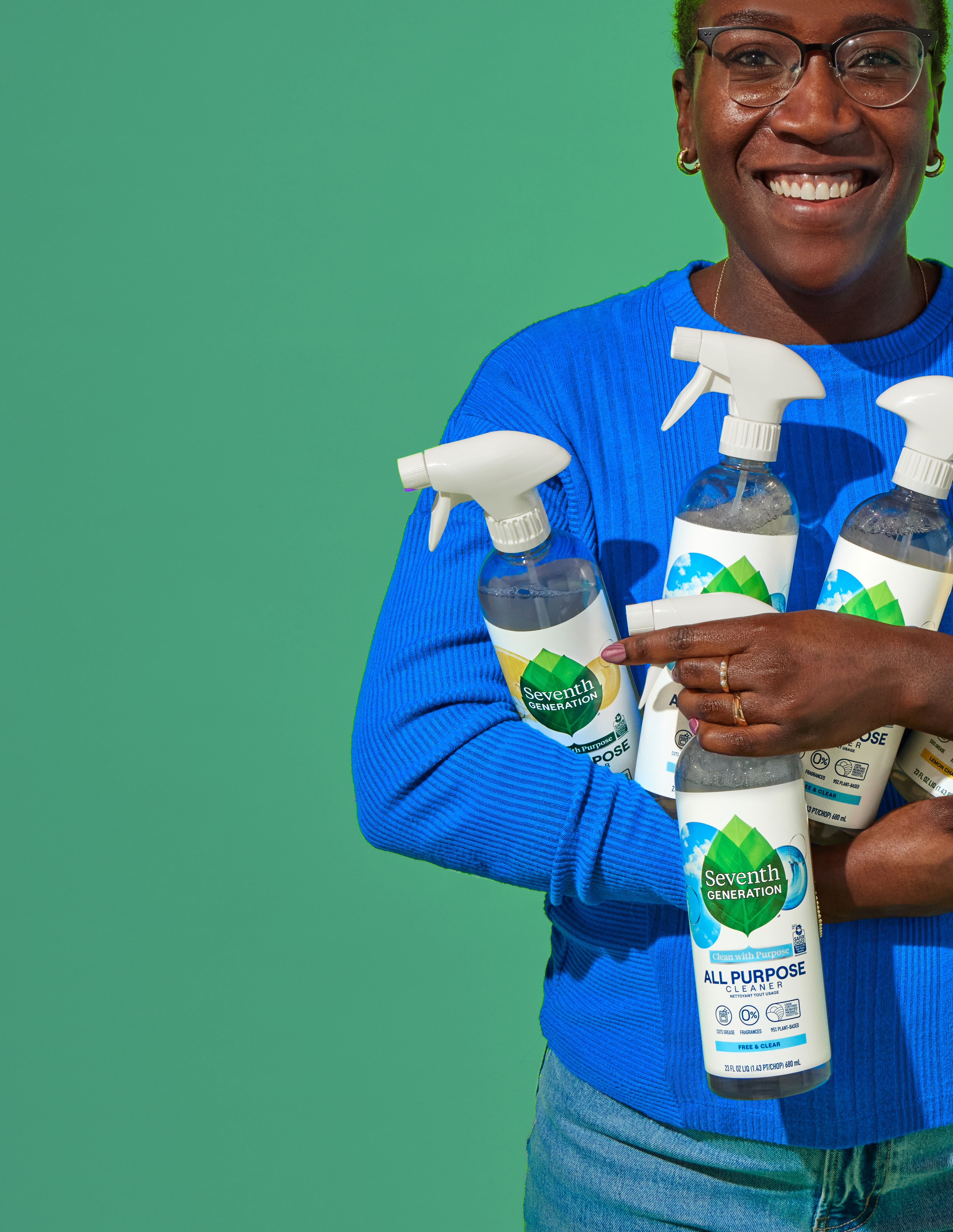 Person holding cleaning products