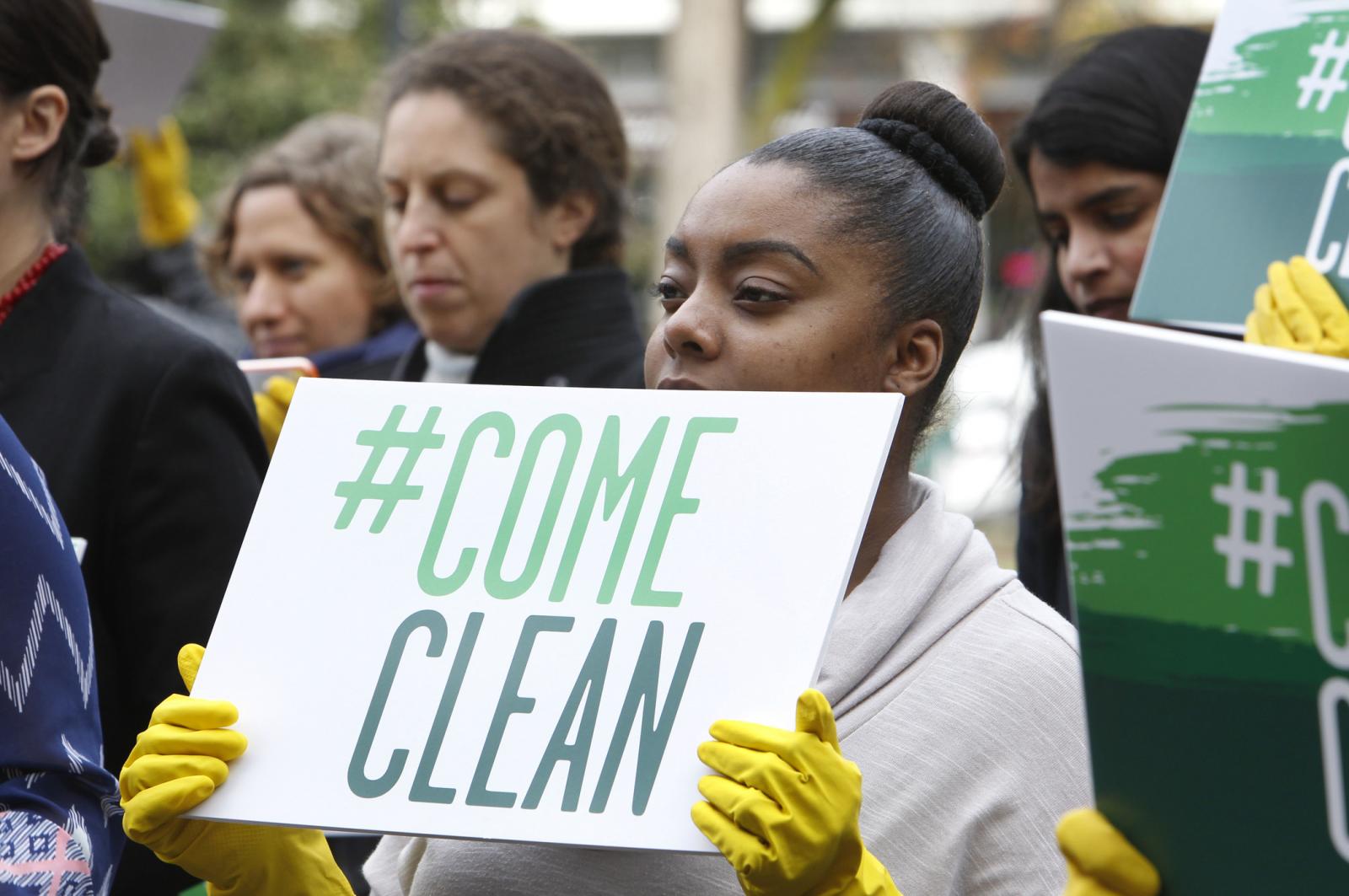 Woman at Come Clean rally.