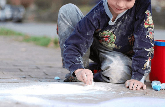 Child Drawing with Chalk