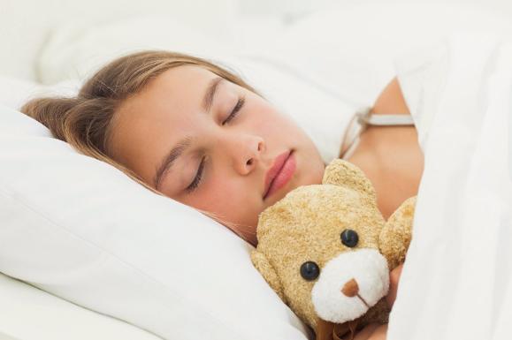 Teenage Girl Sleeping with Teddy Bear