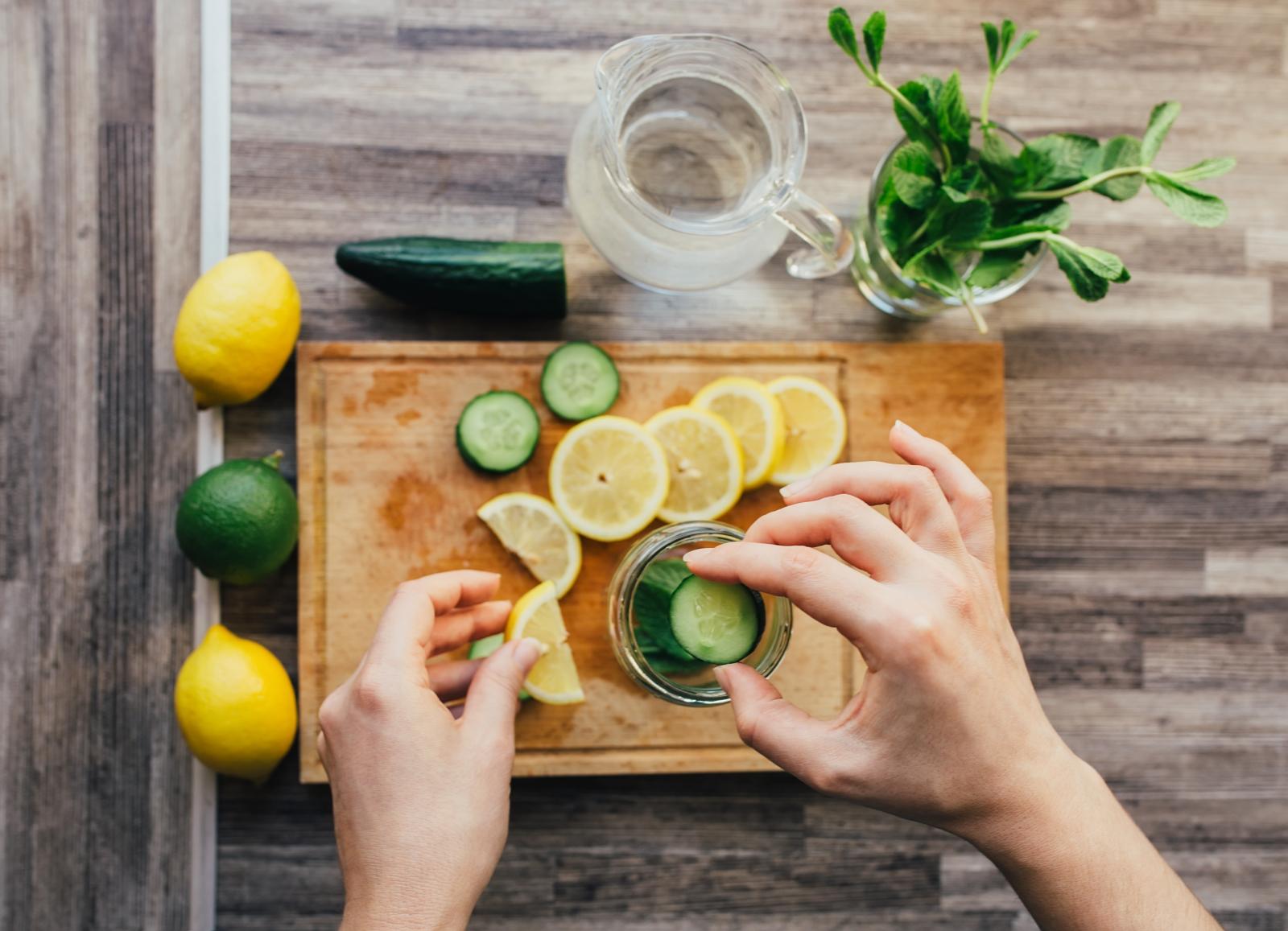 Lemon, Cucumber and mint on cutting board