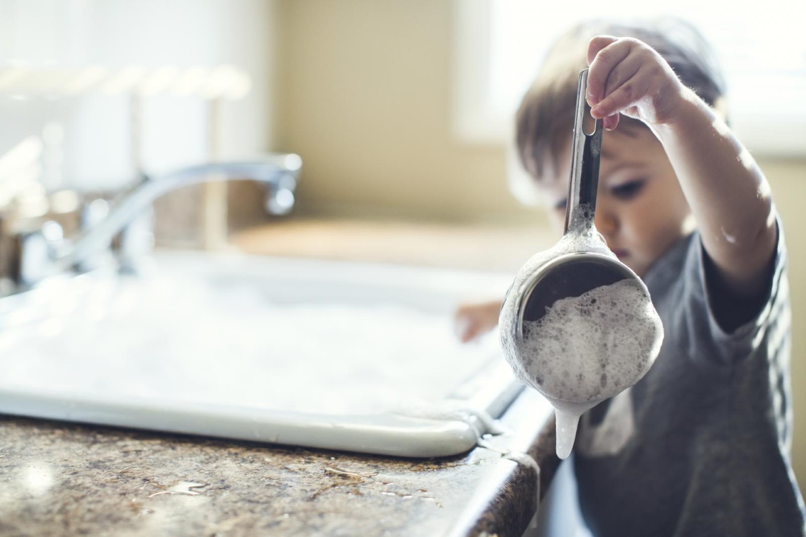 Child Washing Dishes