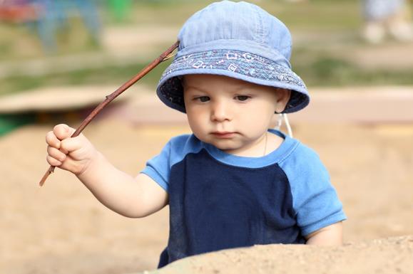 Toddler Playing in Sandbox