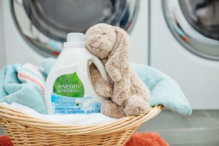Seventh Generation Laundry Detergent with a Pile of Clothes