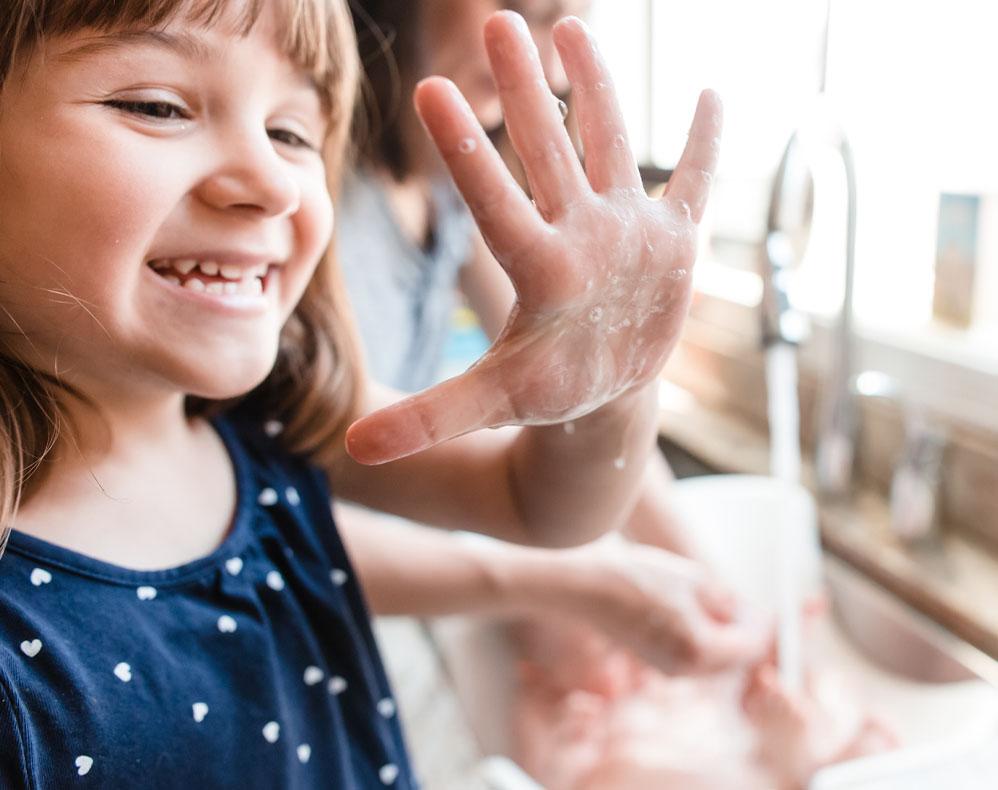 Girl washing her hands