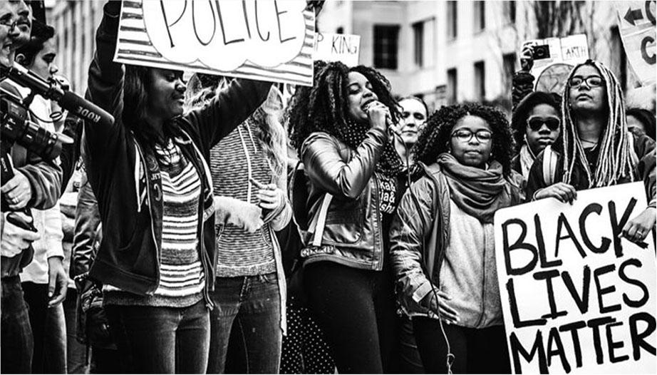 People holding black lives matter sign