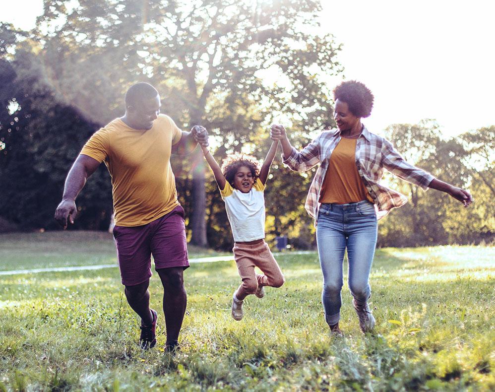 Family playing in field