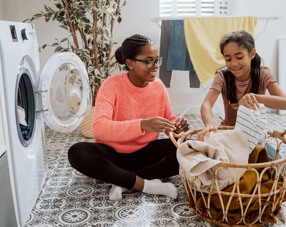 Girls sorting laundry