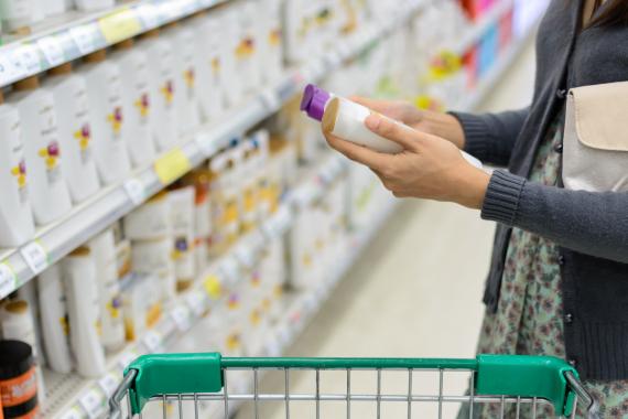 Person holding product in grocery store