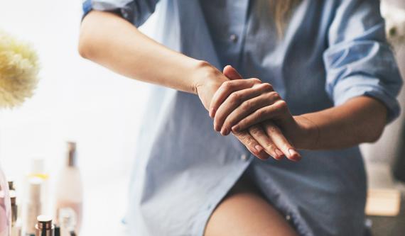 Woman Stretches Wrists