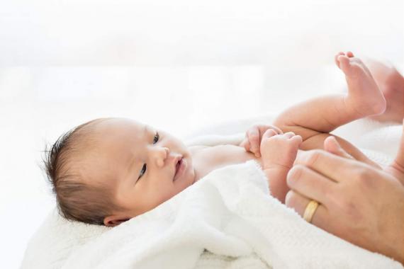 Baby with Parent's Hands