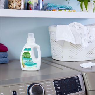 Laundry detergent bottle on top of washing machine