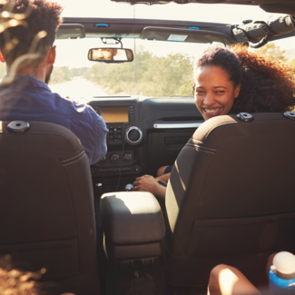 Family in car on road trip - Travel Cleaning Kit Hero Image