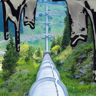 Pipeline cutting through landscape, with oil overlay