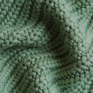Green Knit Fabric - Blog Header Image for How To Wash Winter Clothes