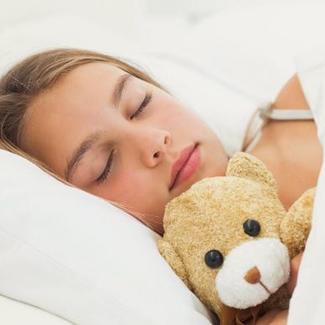 Teenage Girl Sleeping with Teddy Bear