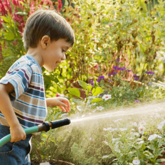 Toddler Using Water Hose