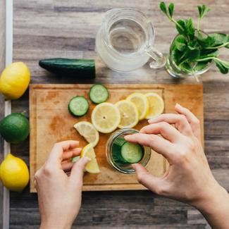 Lemon, Cucumber and mint on cutting board