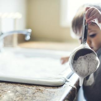 Child Washing Dishes