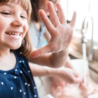Girl washing her hands
