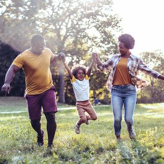 Family playing in field