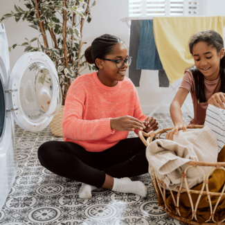 Girls sorting laundry