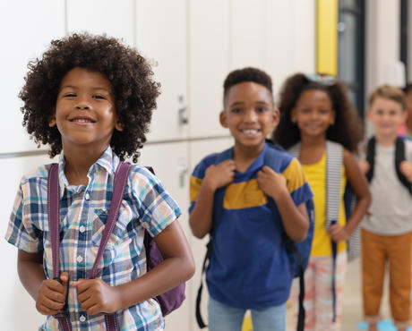 Back To School Kids in line in a school hallway