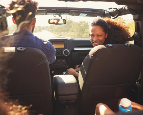 Family in car on road trip - Travel Cleaning Kit Hero Image