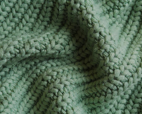 Green Knit Fabric - Blog Header Image for How To Wash Winter Clothes