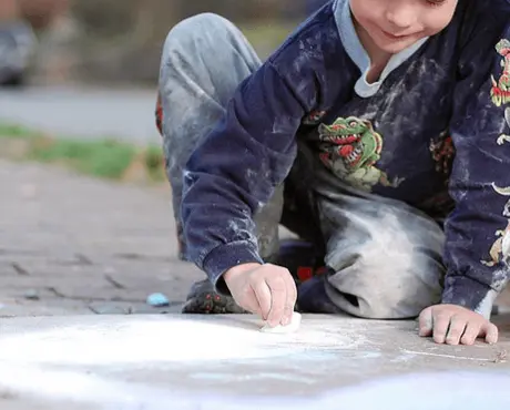 Child Drawing with Chalk