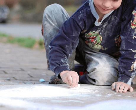 Child Drawing with Chalk