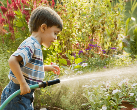 Toddler Using Water Hose