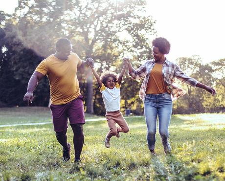 Family playing in field