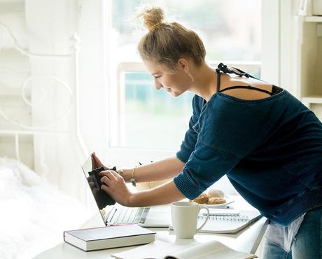 Woman in her dorm room