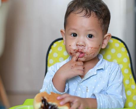 Baby Making a Mess with Chocolate