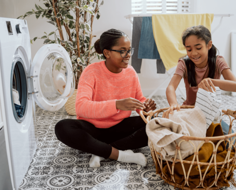 Girls sorting laundry