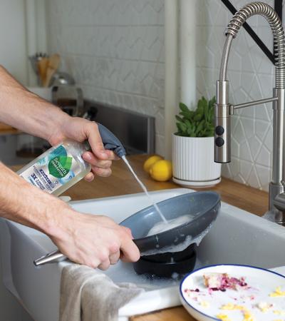 Foaming Dish Spray Free and Clear - person doing dishes 