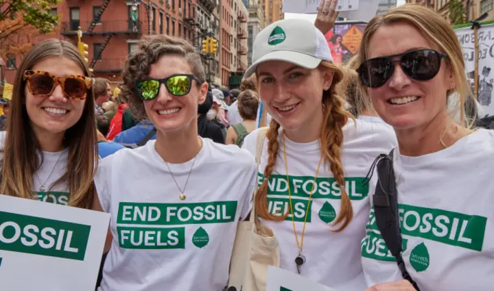 People at Rally in New York City - T-Shirts read End Fossil Fuels