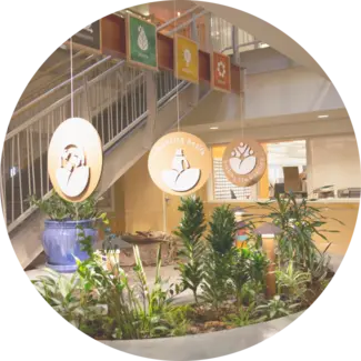 Interior of Seventh Generation headquarters featuring three of our values displayed from ceiling