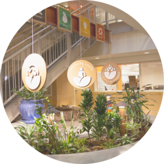 Interior of Seventh Generation headquarters featuring three of our values displayed from ceiling