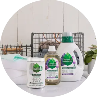 Seventh Generation 90oz, EasyDose, and Zero Plastic Laundry Detergents sitting on a washing machine