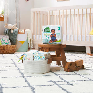 Seventh Generation Size 3 diapers sitting on stool