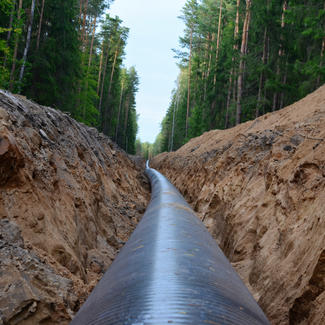 Pipe Line in ditch through forest