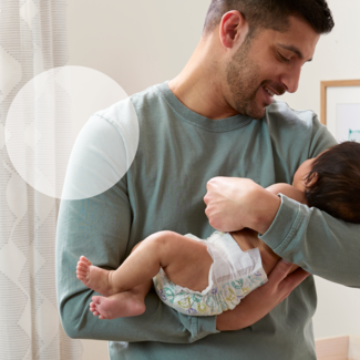 caregiver holding new baby