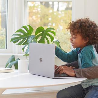 Family looking at laptop computer