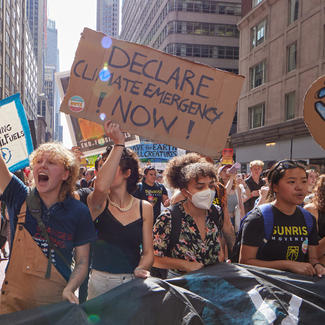 2023 March to End Fossil Fuels - Young Marchers with Signs and Banner