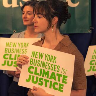 Climate Justice Activists holding signs